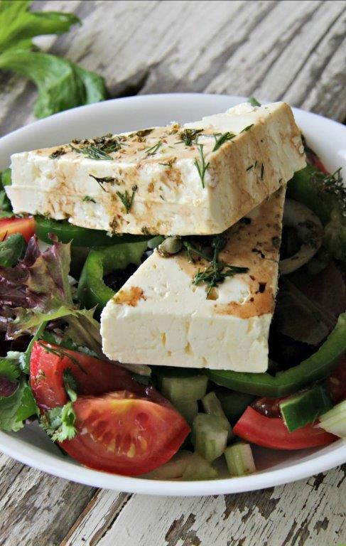 In Greece- Greek Salasd is simply known as Village Salad and is made with what is available so no too are alike. This Easy Greek Village Salad recipe will have you thinking you are in the Greek Islands! gluten free, healthy, vegetarian